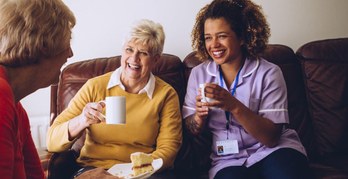 Caregiver Sharing Tea Time with her Patients