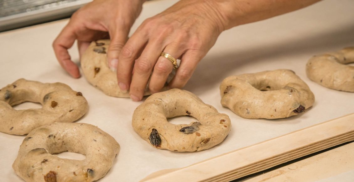 making bagels – raw dough formed into shape of bagels